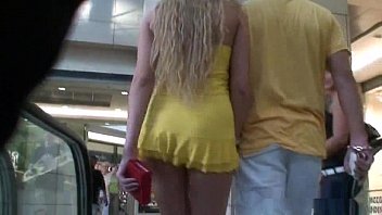 gorgeous blonde walks in shopping with short dress