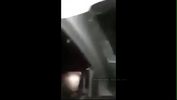 The whore is masturbating with a banana in the car on the road in front of the drivers, and wildly moaning