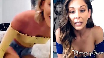MILF and her stepdaughter rub their shaved pussies online